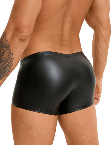 a man with a tattoo on his arm wearing a black leather shorts